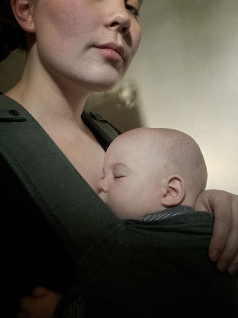 Baby sleeping in stretchy wrap