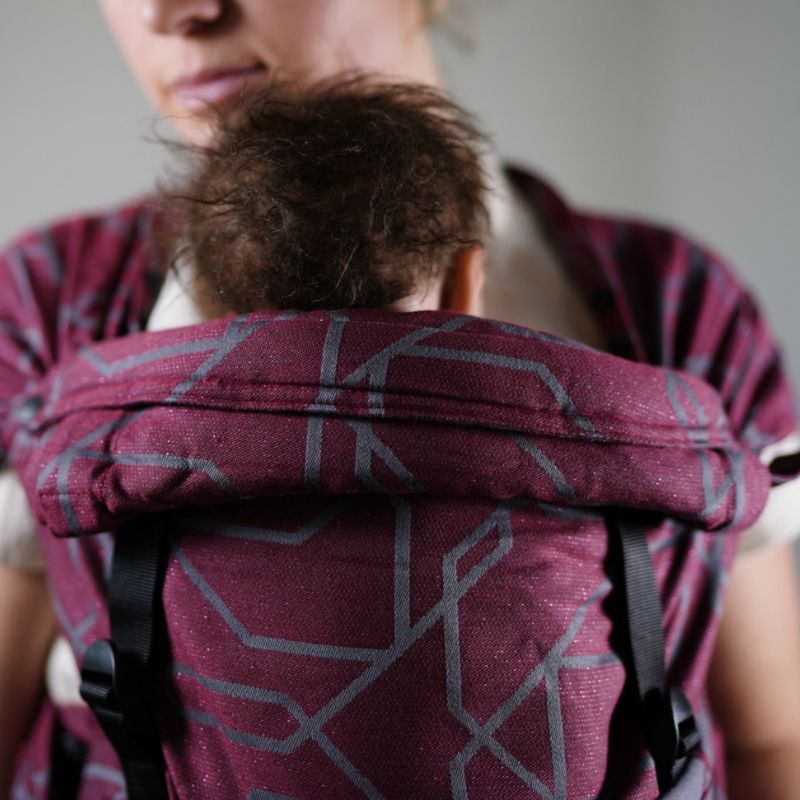 Babuebaby Mbereko baby carrier in jasper worn on the front with baby supported, close up of headrest 2 Babuebaby Mbereko baby carrier in jasper worn on the front with baby supported, close up of headrest 2