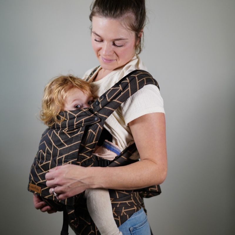 Babuebaby carrier in fractal worn on the front with baby supported, mom looking at baby2