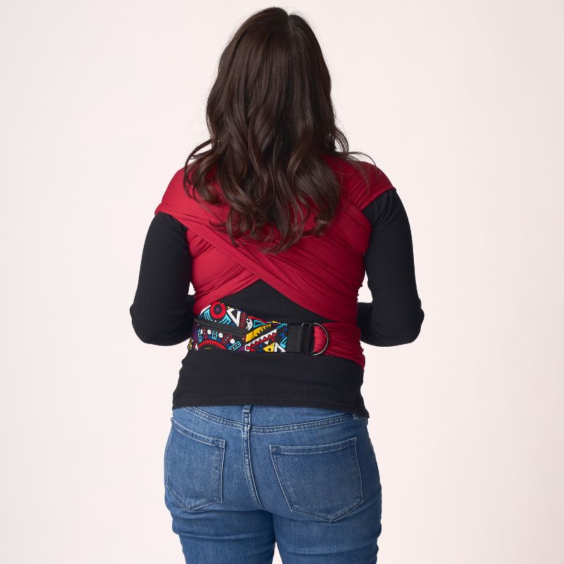 Woman facing away in scarlet Kitoto Stretchy Wrap